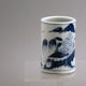 China Qingcai brushpot depicting a man fishing in a landscape, ca. 1780.