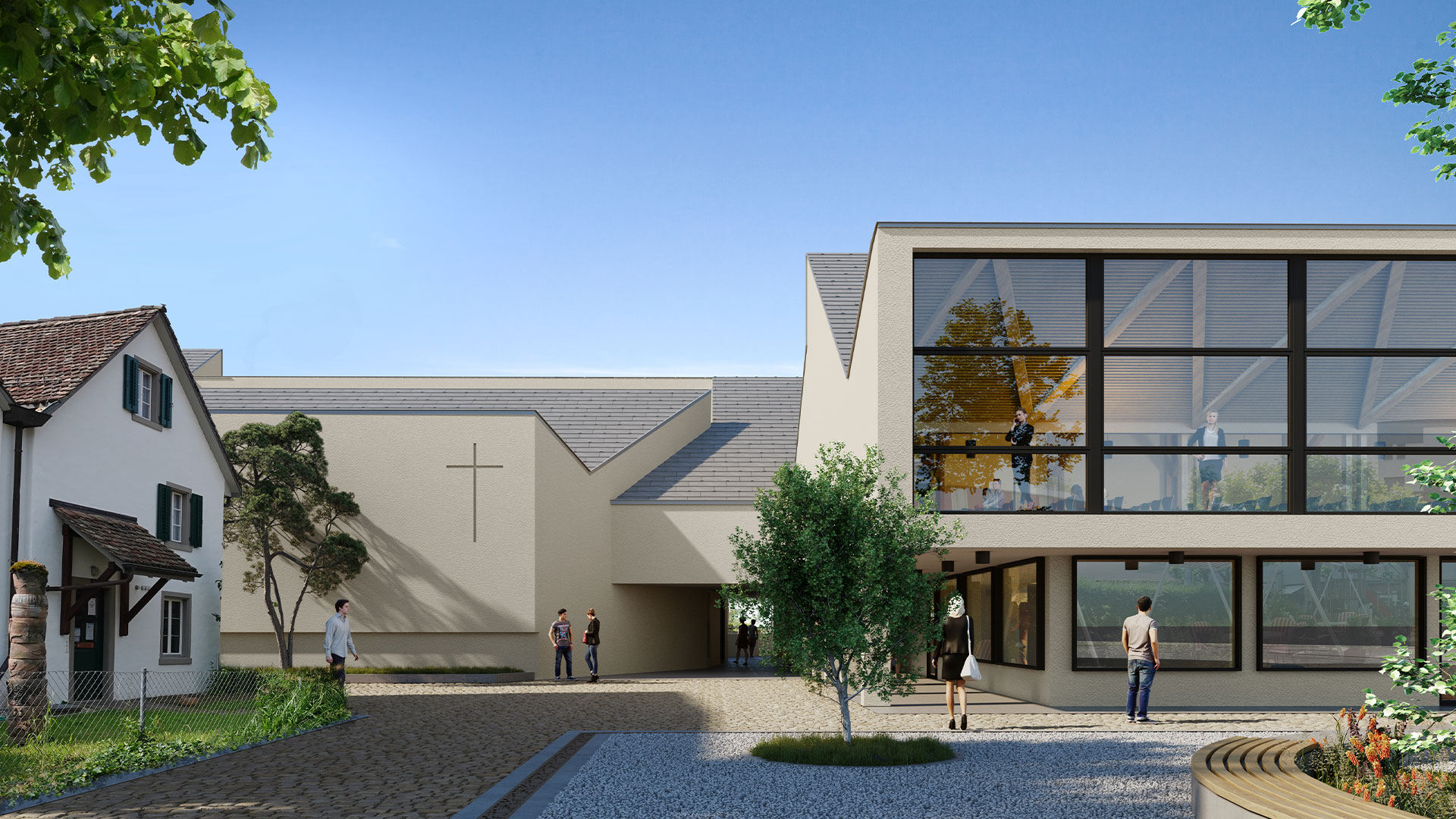Das GZZ ist heute wenig mit dem Dorfplatz verknüpft. Neu öffnet es sich – mit einer Fensterfront im Kirchgemeindesaal und mit dem neuen Eingang zur katholischen Kapelle, der nun vis-à-vis vom Haupteingang des GZZ liegt. Die Ladenflächen bleiben bestehen.