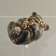 Figurine in grey stoneware with mottled glaze, the original modelled by Knud Kyhn in 1930 for Royal Copenhagen, produced 1957 L9cm